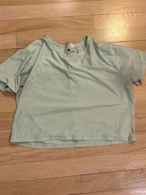 All in motion teal cropped athletic shirt kids large...